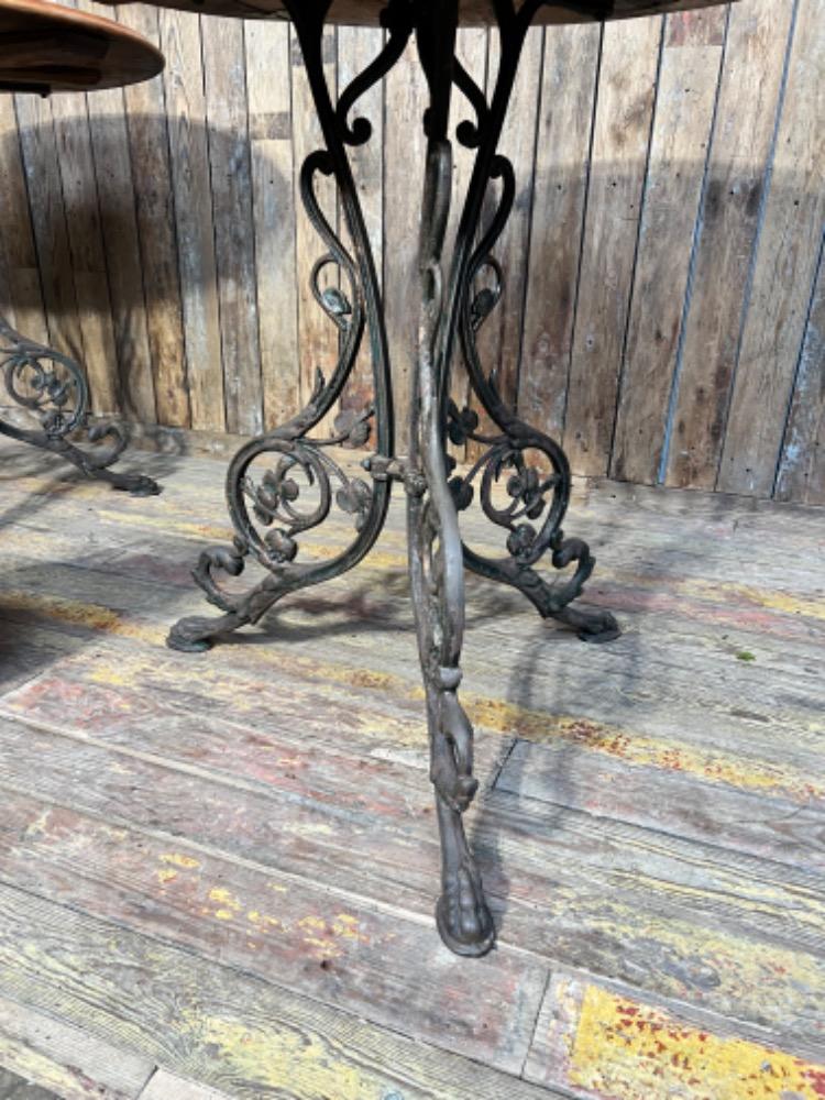 Cast iron pedestal tables, early 20th century