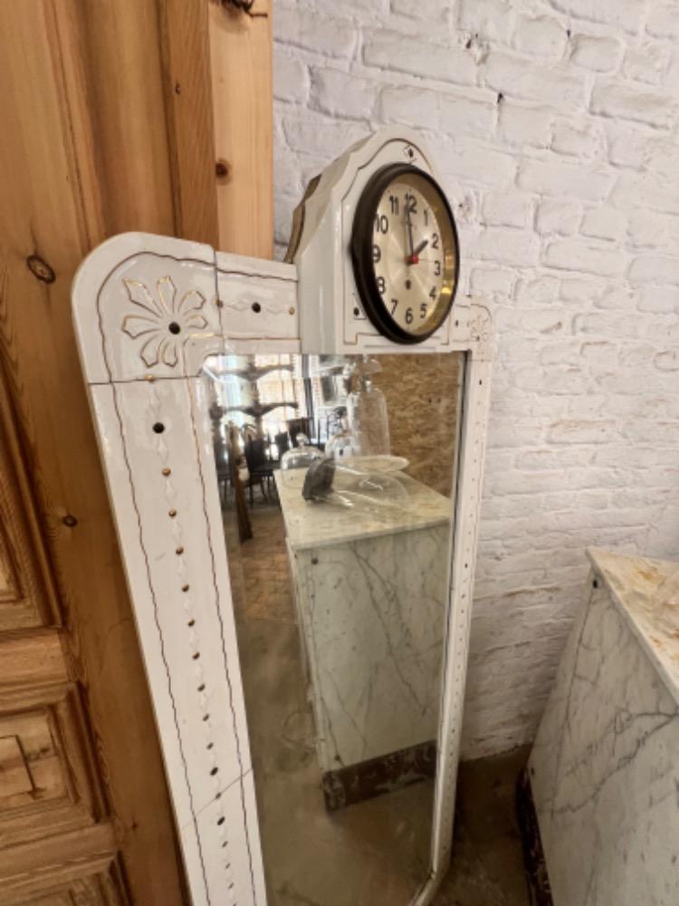 Earthenware mirror with clock, early 20th century 