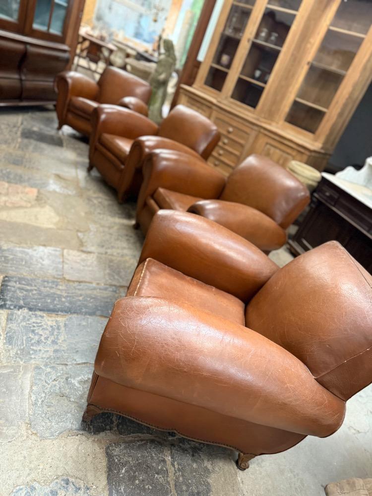 SET OF 4 LEATHER CLUBS, MID-20TH CENTURY